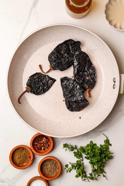 Charred Poblano Peppers on Cooking Pan for Roasting.