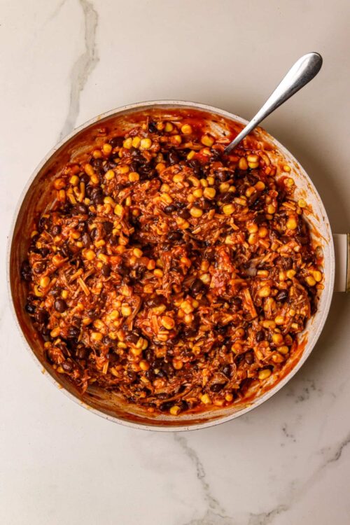 Hearty vegan black bean and corn chili in a skillet. Perfect for quick, flavorful plant-based dinners and meal prep.