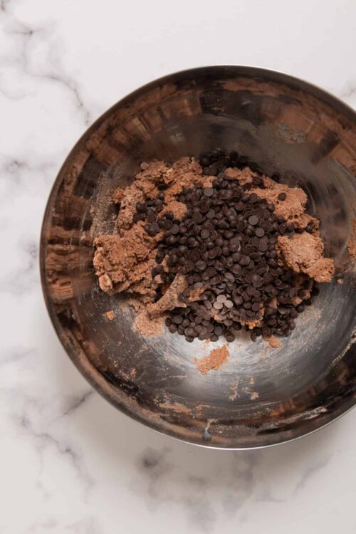 Creamy chocolate cookie dough with chocolate chips.