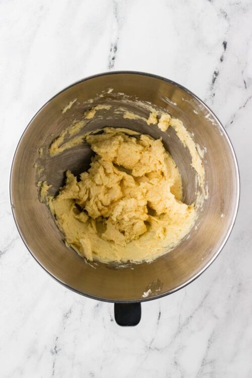 Creamy cookie dough in a mixing bowl ready for baking.