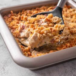 Creamy chicken pot pie with golden breadcrumb topping in a baking dish.