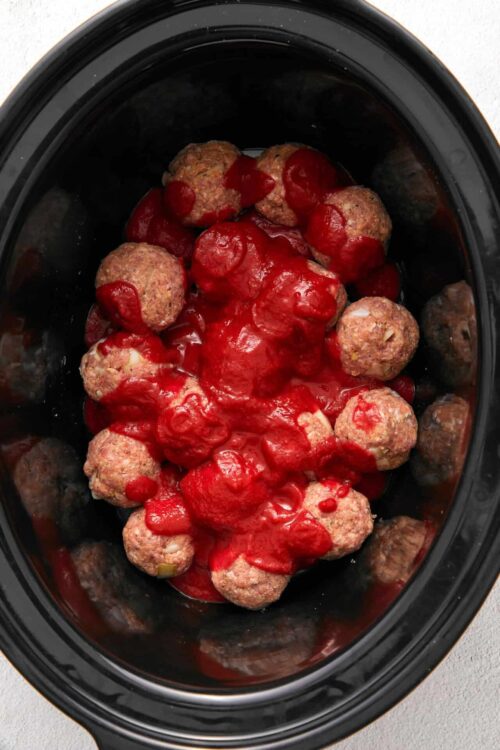 Meatballs with tomato sauce in a slow cooker.