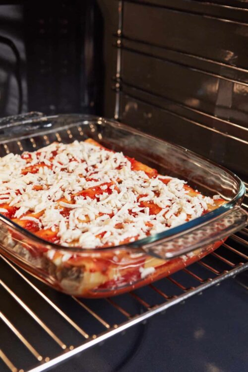 Baked cheesy layered casserole in oven dish.