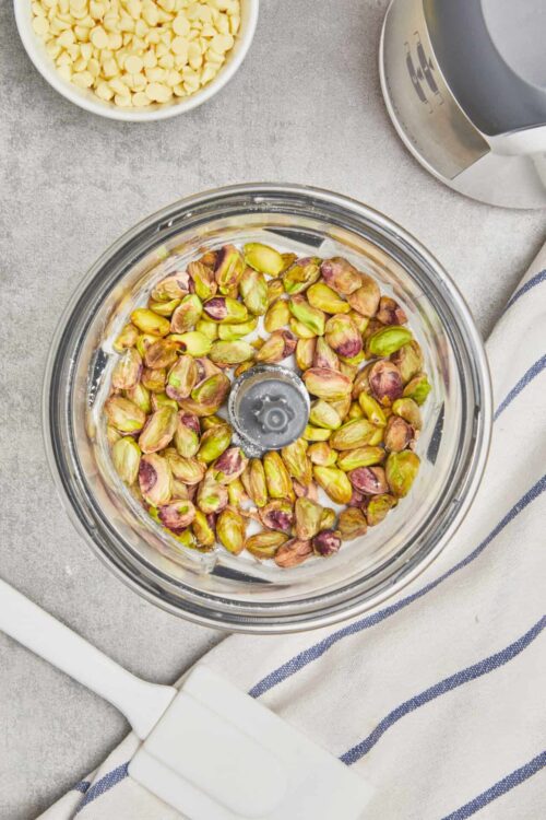 Roasted pistachios in food processor for baking recipes.