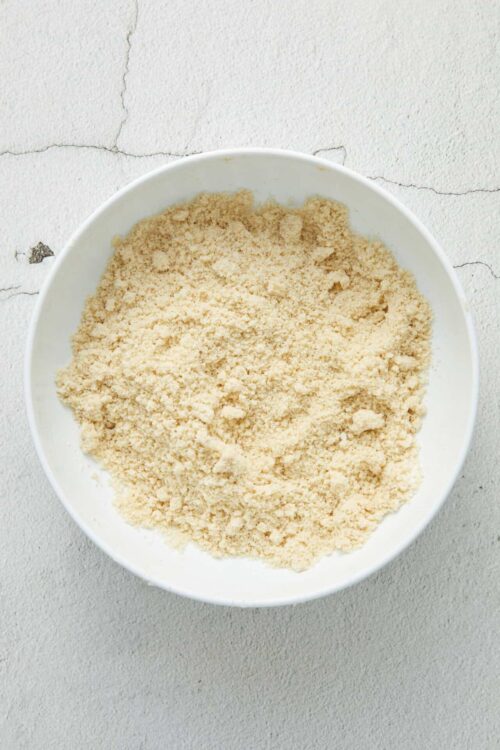 Finely ground flour in a white bowl for baking.