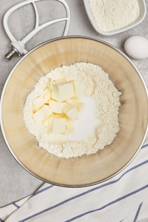 Flour and butter in a mixing bowl for baking recipes.