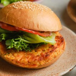 Fresh homemade chicken patty sandwich on a sesame bun with lettuce and tomato.