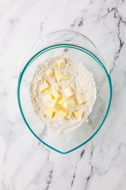 Flour and butter in a mixing bowl for baking recipes.