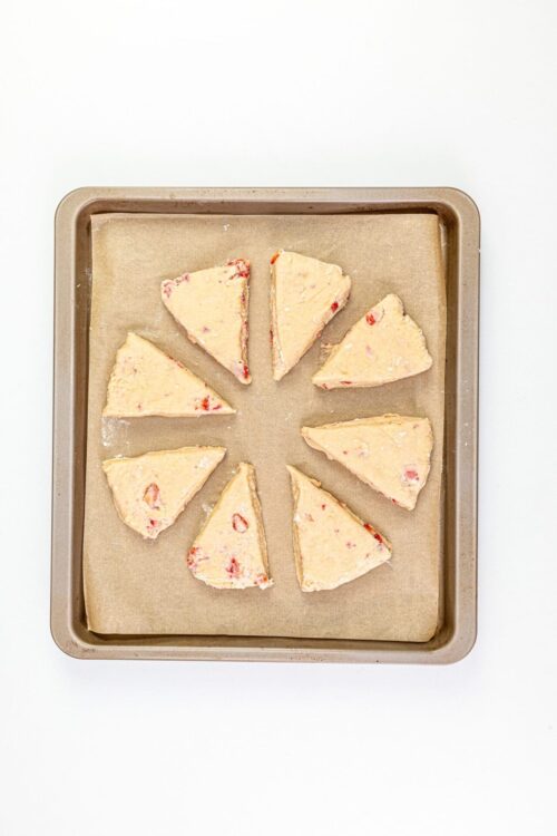 Cream cheese strawberry biscotti dough on a baking sheet, ready to bake.