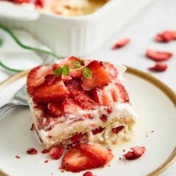 Fresh strawberry shortcake dessert with whipped cream and vanilla cake.