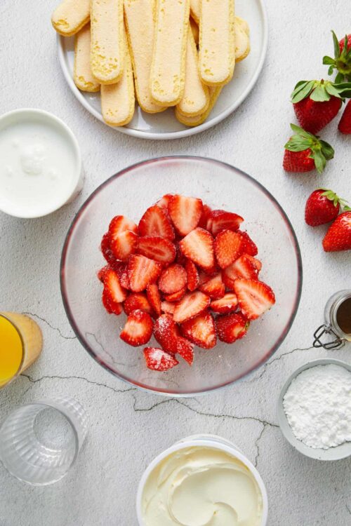 Fresh strawberries and ladyfinger cookies for strawberry shortcake dessert.