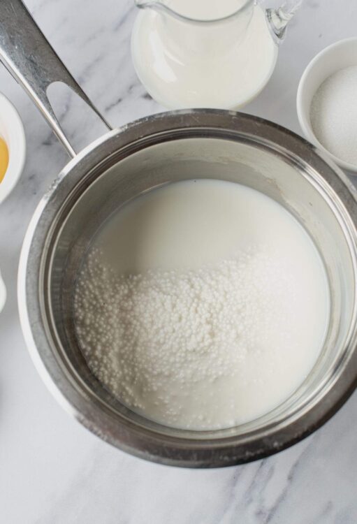Cream being heated in a double boiler for baking.