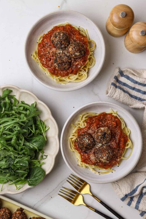 Satisfying plate of spaghetti and meatballs with tomato sauce.