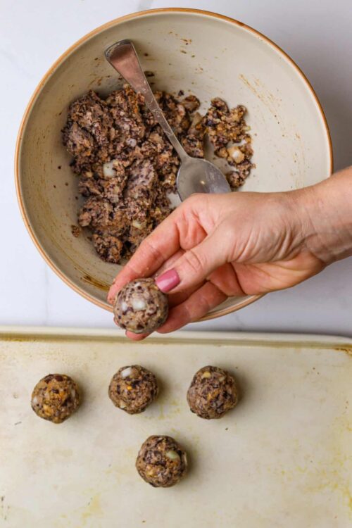 Chocolate energy bites made with oats and nuts, ready for baking or chilling. Easy homemade snack recipe.