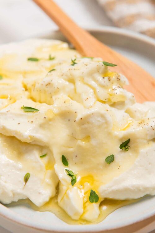 Creamy homemade mashed potatoes with butter and herbs.