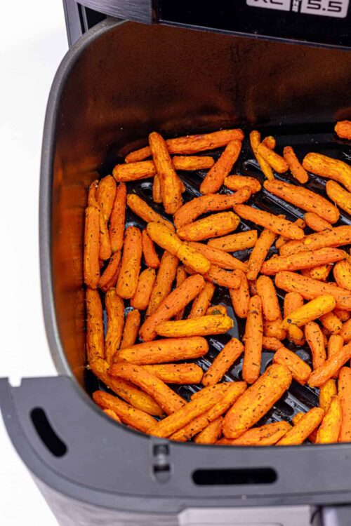 Sweet potato fries in air fryer, crispy roasted sweet potato sticks, healthy air fryer sweet potatoes recipe, easy homemade sweet potato fries, Baked Bree cooking blog.
