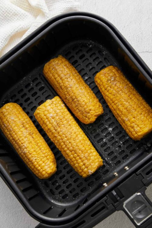 Golden roasted corn on the cob in an air fryer for a delicious summer side dish. Perfectly cooked, flavorful, and easy to prepare.