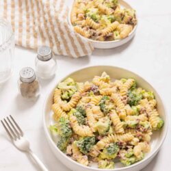Creamy broccoli pasta salad with rotini, cheese, and a fresh dressing, perfect for summer picnics and potlucks.