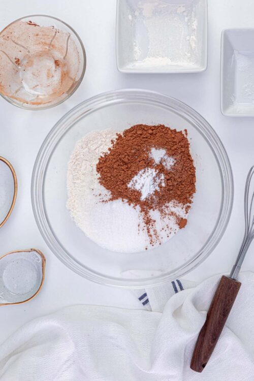 Flour and cocoa powder mixture for baking, on white countertop.