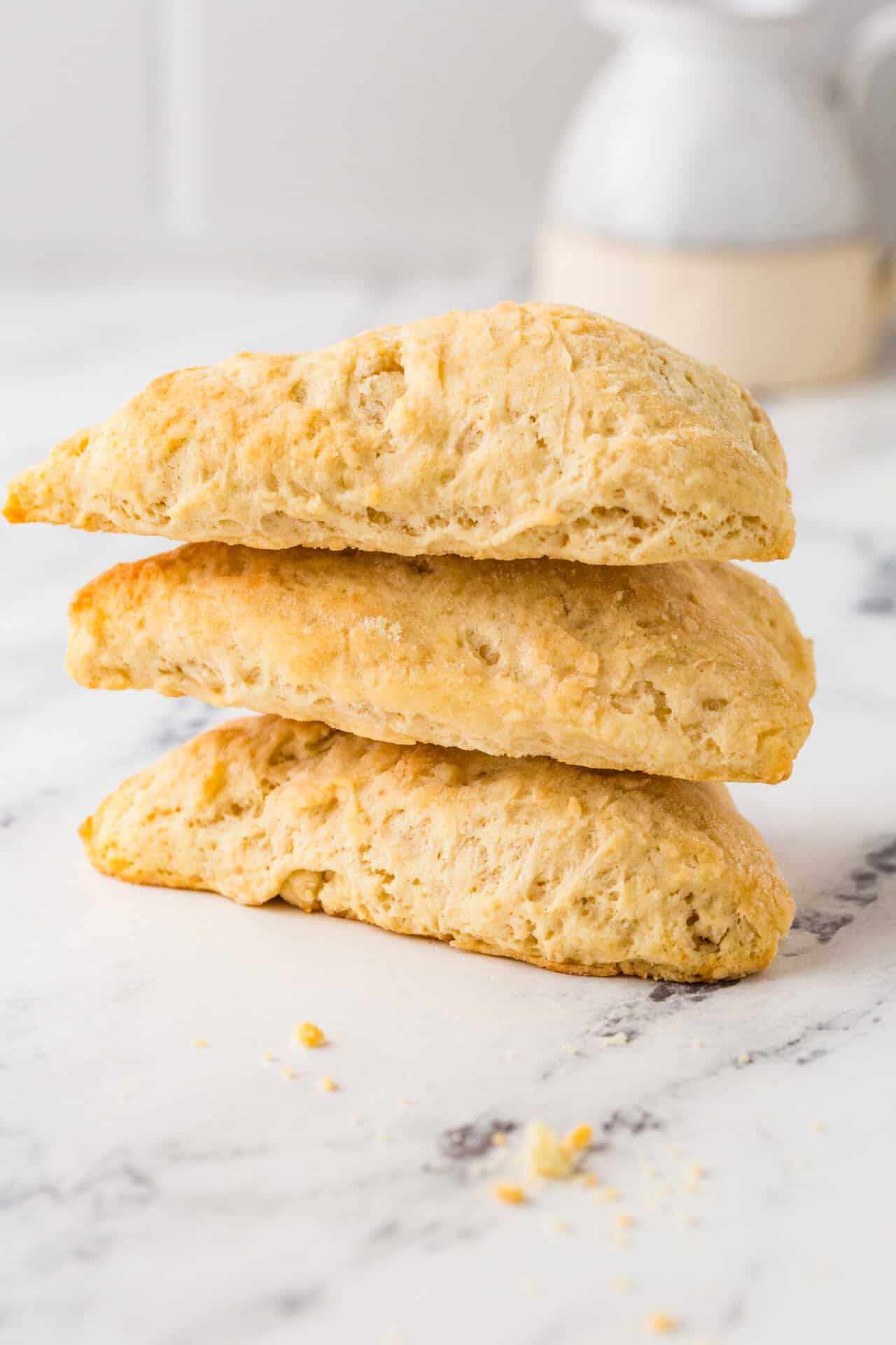 Fluffy homemade scones with golden-brown crust, perfect for breakfast or tea time.