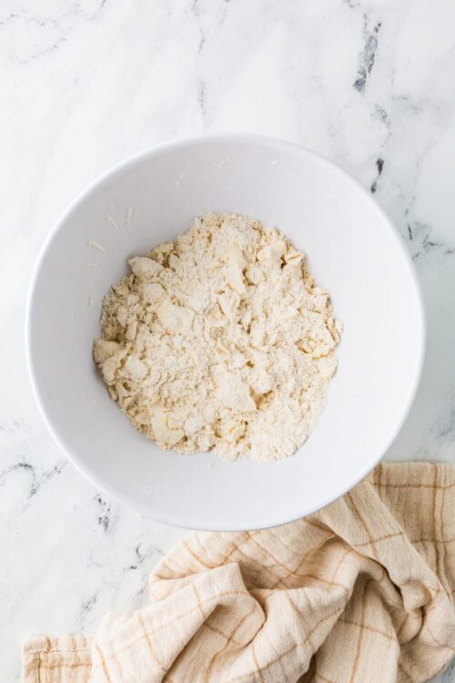 Flour mixture in white bowl for baking bread or pastries.
