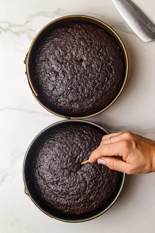 Decadent chocolate cakes baked in round pans with a moist, rich texture. Perfect for dessert or special occasions.