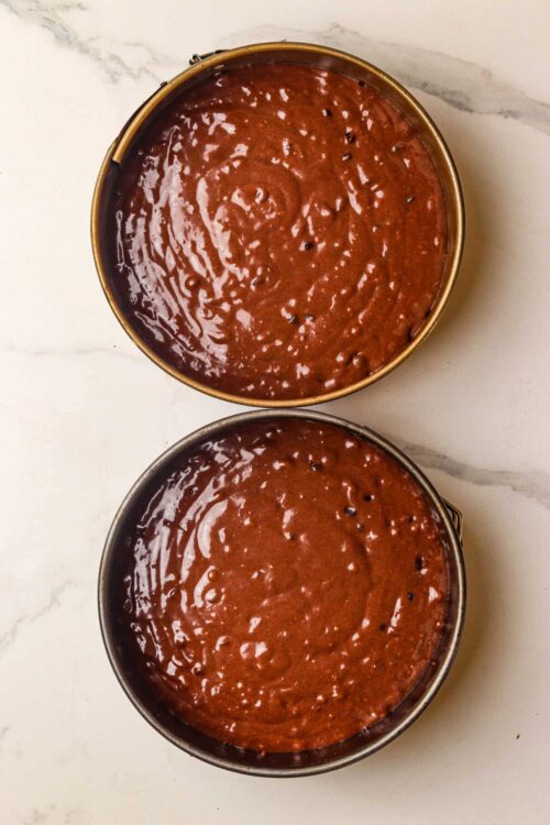 Rich chocolate fudge sauce in metal pans.
