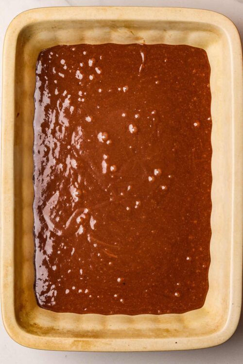 Sweet and spicy barbecue sauce in a baking dish with a rich, glossy finish. Perfect for grilling, dipping, or as a marinade.