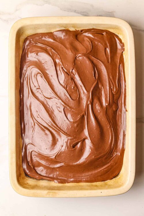 Rich chocolate frosting on homemade cake, dessert, or brownies.
