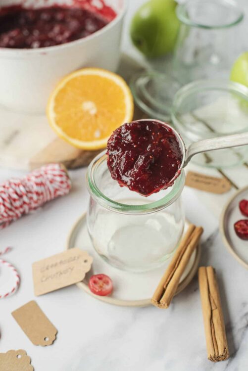 Fresh homemade cranberry orange jam in a glass jar.