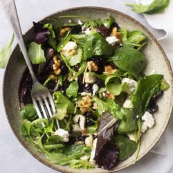 Fresh mixed green salad with feta cheese, walnuts, and balsamic vinaigrette. Perfect healthy recipe for light lunches or dinners.