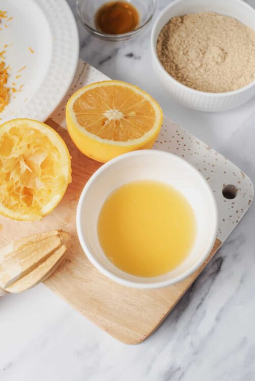 Fresh orange halves and lemon slices for citrus baking and cooking.