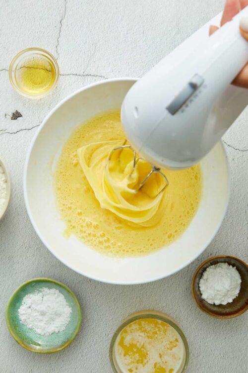 Butter being whipped in a mixer for baking recipes on Baked Bree website.