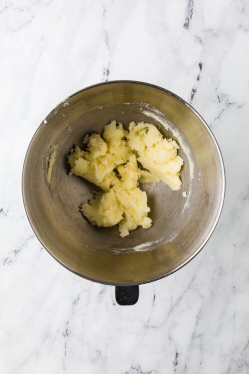 Buttery cookie dough in a mixing bowl for baking recipes.