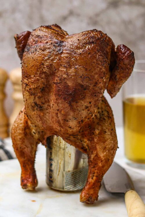 Roast Whole Chicken on a can, crispy skin, perfect for Sunday dinner.