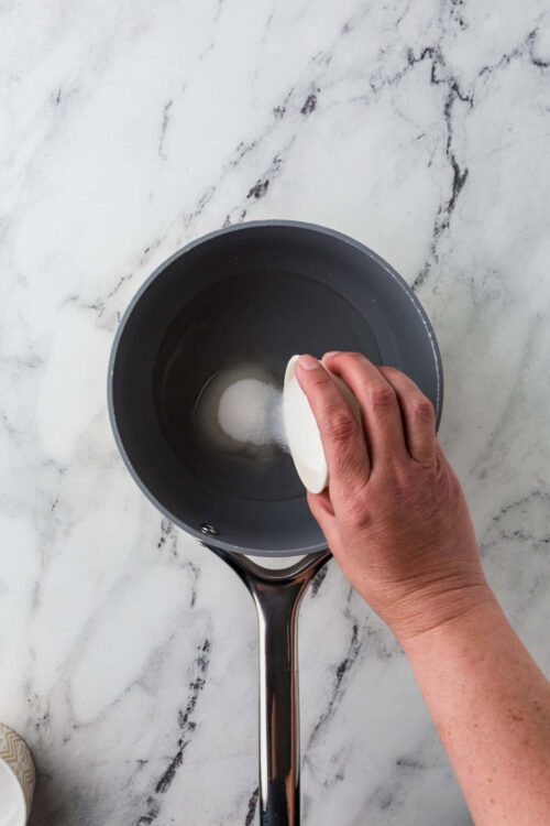 Butter melting in a saucepan for baking or cooking.