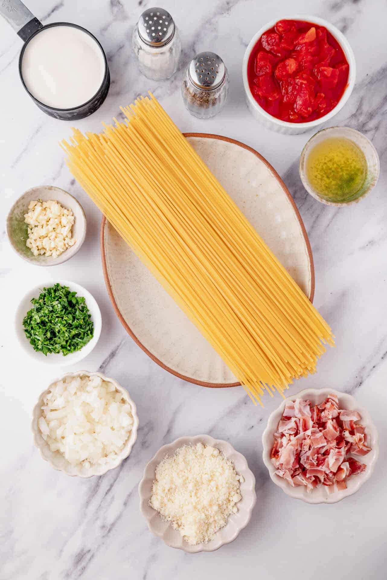 Dry spaghetti pasta with Italian toppings for a delicious homemade pasta dish.