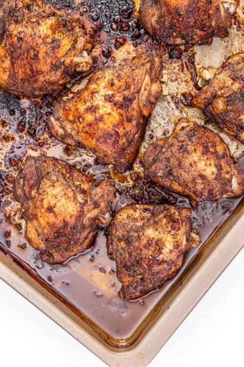 Juicy baked chicken thighs with crispy, seasoned skin and flavorful gravy. Perfect for easy and delicious family dinners.