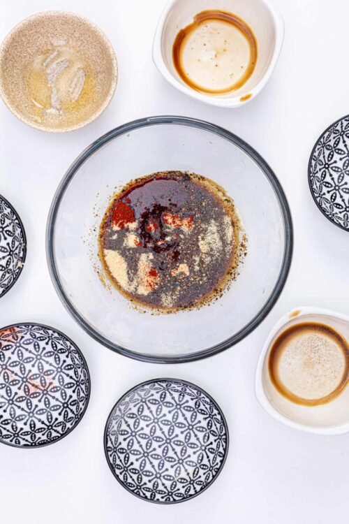 Seasoning spices for baking recipe in glass bowl, ingredients for baked goods, baking preparation.