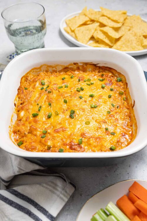 Creamy Baked Cheesy Mexican Casserole with melted cheese and green onions. Perfect comfort food for dinner or leftovers.