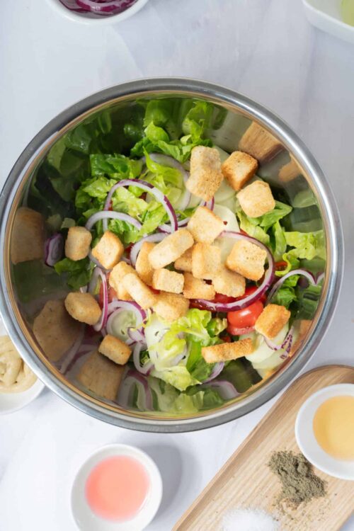 Fresh garden salad with croutons and mixed vegetables. Perfect for healthy eating and lunch ideas.