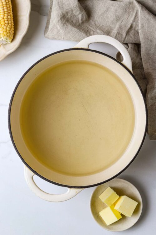 Buttered cast iron skillet for baking and cooking, ready for recipes or roasting, close-up view.