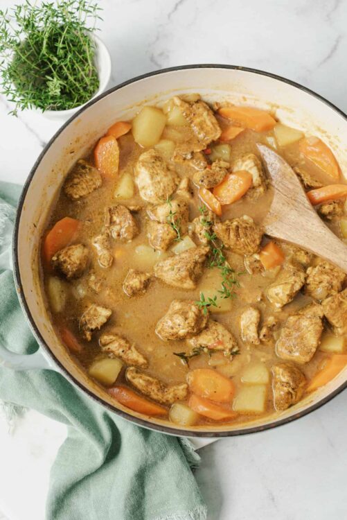 Savory chicken stew with potatoes and carrots in a creamy broth.