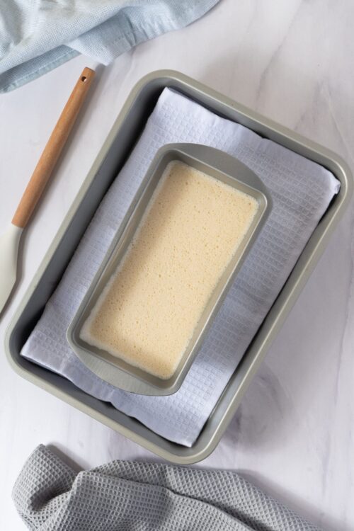 Creamy batter in a loaf pan ready for baking.