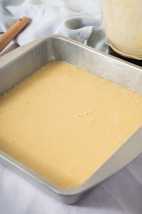 Fluffy cake batter in a baking pan for homemade cake baking.