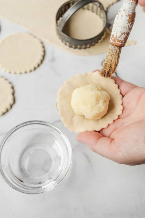Buttercrust pastry being filled with butter for pie making, cooking, baking.
