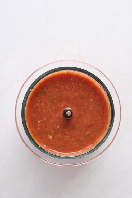 Rich tomato salsa blended, ready for serving or cooking, made with fresh ingredients.
