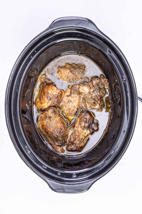 Succulent slow cooker chicken thighs in rich sauce. Perfect for hearty family dinners and meal prep.