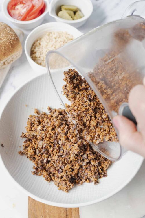 Crumbled nut and cookie topping for baked goods, close-up.