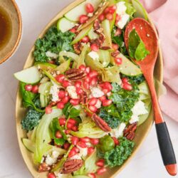 Fresh Mediterranean salad with pomegranate, pecans, feta cheese, and mixed greens.
